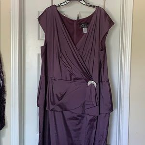 Make a statement in this purple peplum gown!